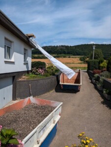 Stortslurf flexible rubbish chute in use — product photo 01